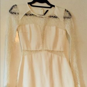 Ivory dress with lace detail in the front